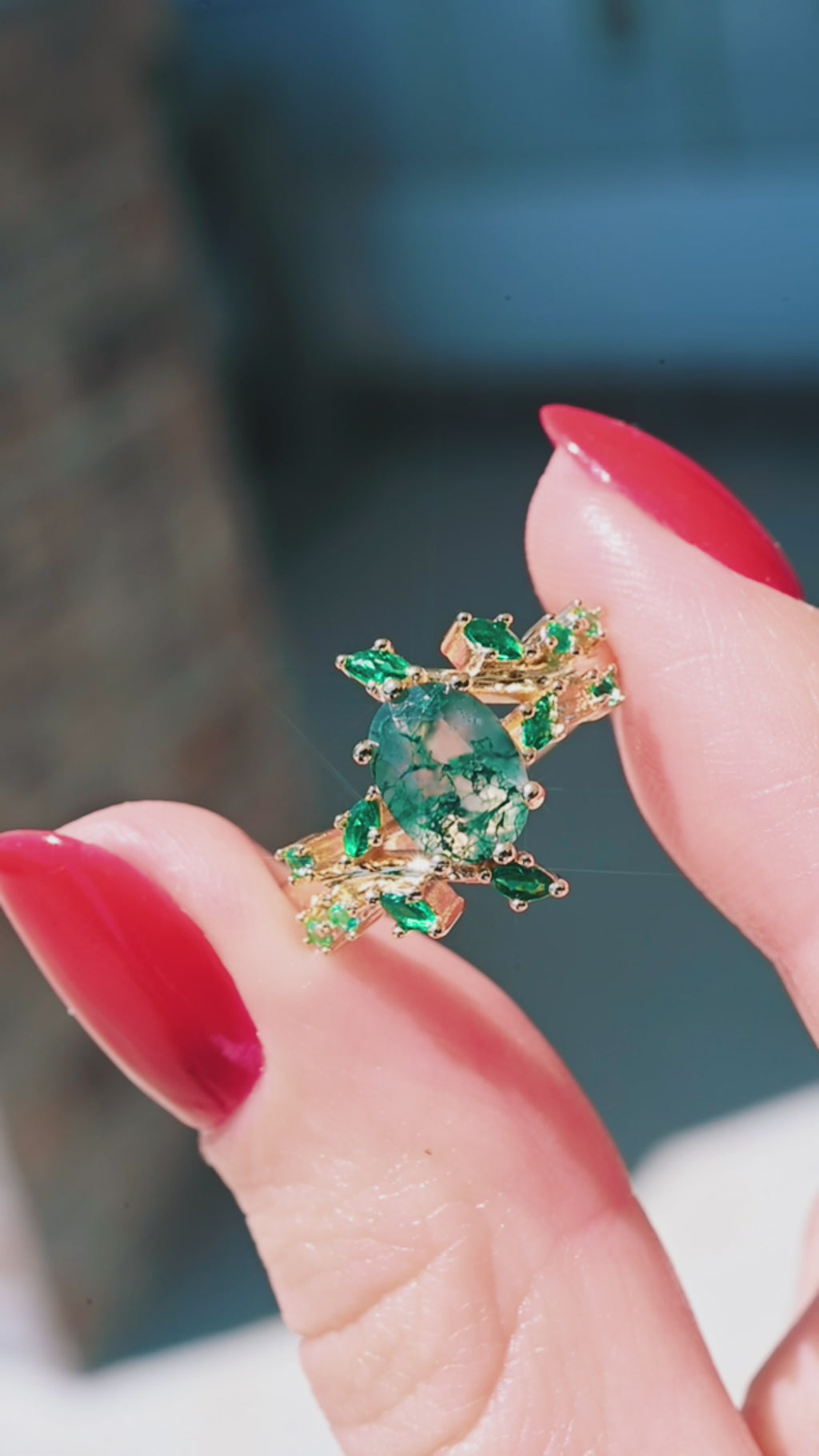 Video of the moss agate and emerald leaf engagement ring by Aquamarise, shown in motion