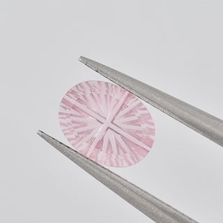 Lab-Grown Pink Sapphire oval 6 x 8 mm Faelight Cut video, turning to show the starburst flashes