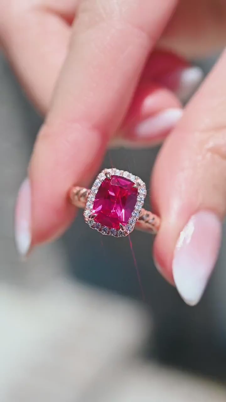 Hand holding Ruby Engagement Ring Cushion Cut Ruby Halo Ring
