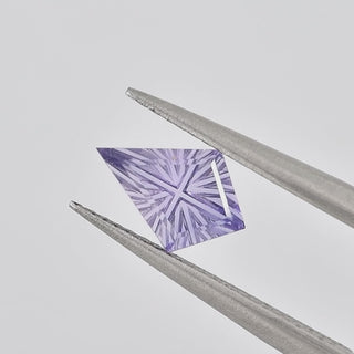 Lab-Grown Lavender Purple Sapphire kite 6 x 9 mm Faelight Cut video, turning to show the starburst flashes