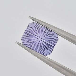 Lab-Grown Lavender Purple Sapphire rectangle 6 x 8 mm Faelight Cut video, turning to show the starburst flashes