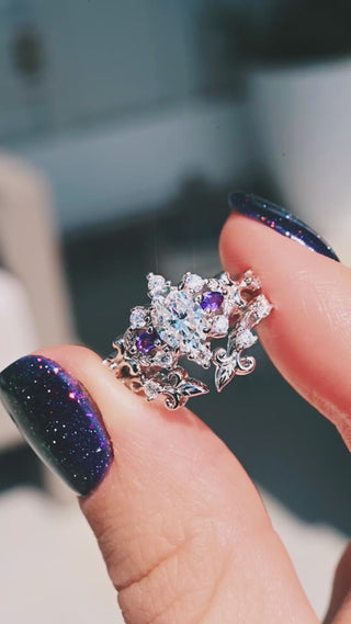 Video of the Carmilla moissanite and amethyst engagement ring with its enhancer band turning in sunlight
