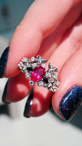 Video of the Carmilla lab-grown ruby and black onyx bridal ring set turning in sunlight