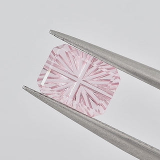 Lab-Grown Pink Sapphire rectangle 6 x 8 mm Faelight Cut video, turning to show the starburst flashes