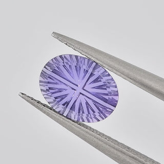 Lab-Grown Lavender Purple Sapphire oval 6 x 8 mm Faelight Cut video, turning to show the starburst flashes