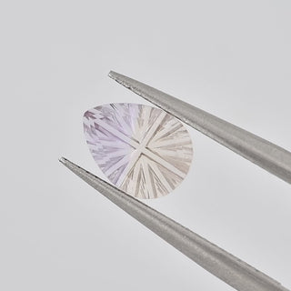 Natural Ametrine pear 6 x 8 mm Faelight Cut video, turning to show the starburst flashes