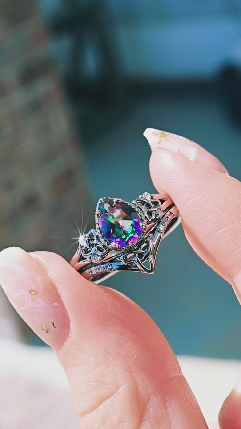 Video of the Celtic knot mystic topaz ring by Aquamarise, showing the rainbow mystic topaz in motion