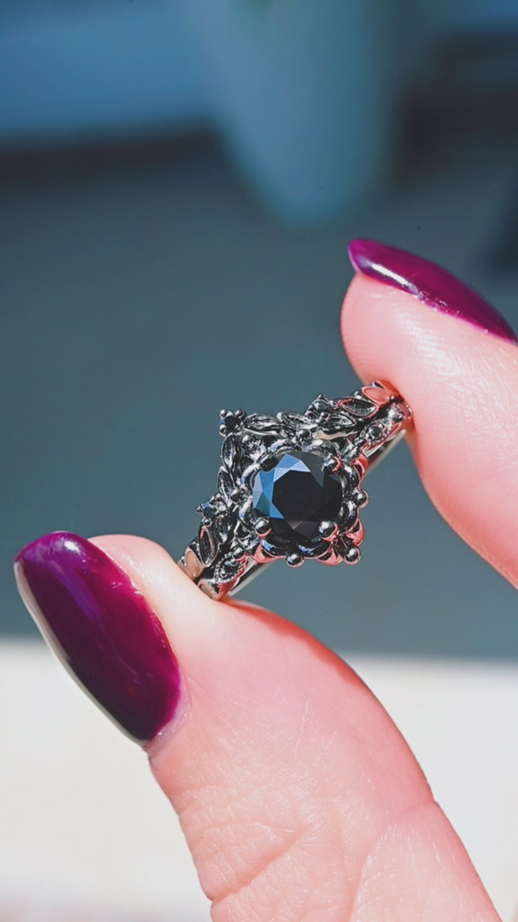 Product video of the Gothic Vintage Floral Ring Set in Black Ruthenium by Aquamarise, showing the black onyx center within vintage floral detailing.