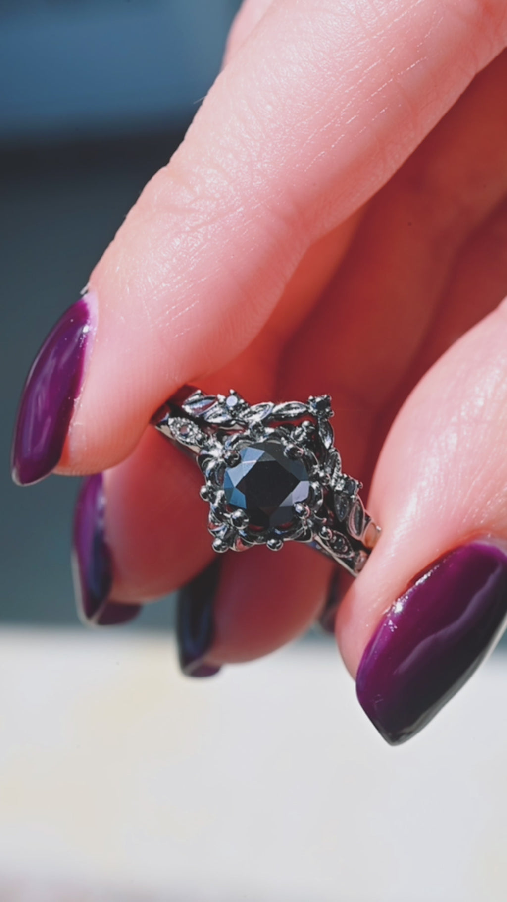Product video of the Gothic Vintage Floral Ring Set in Black Ruthenium by Aquamarise, showing the matching band and black onyx center stone.