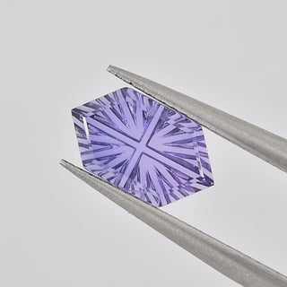 Lab-Grown Lavender Purple Sapphire long hexagon 6 x 10 mm Faelight Cut video, turning to show the starburst flashes