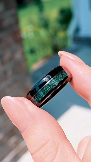 Video of the off-set moss agate and black onyx tungsten band turning to show both inlay channels
