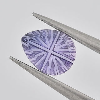 Lab-Grown Lavender Purple Sapphire pear 6 x 8 mm Faelight Cut video, turning to show the starburst flashes