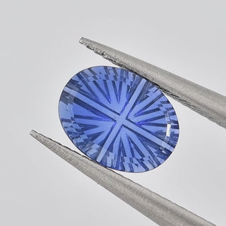 Lab-Grown Blue Sapphire oval 6 x 8 mm Faelight Cut video, turning to show the starburst flashes