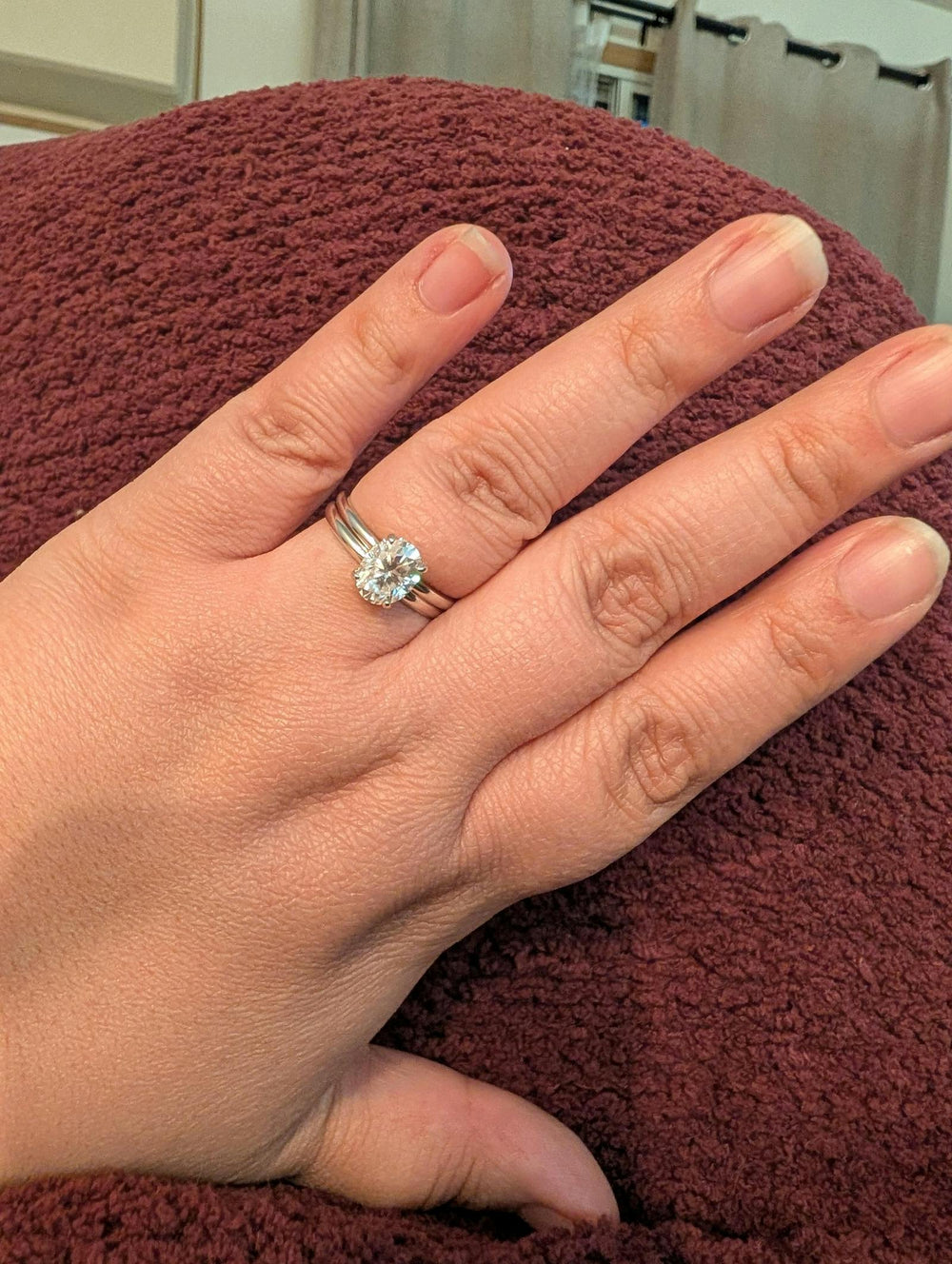 Oval Solitaire Engagement Ring with Hidden Halo in sterling silver worn by a verified Aquamarise customer, photo from her review