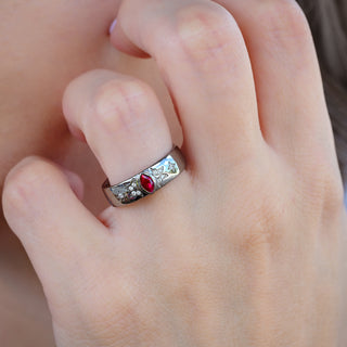 Ruby Celestial Wedding Band in Black Ruthenium (6mm) worn on the hand