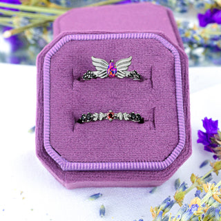 Selene Magenta Opal and Black Onyx wing ring with Padparadscha Sapphire crescent moon band in black ruthenium stacked in a pink velvet ring box