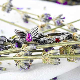 Selene Magenta Opal and Black Onyx wing ring with Padparadscha Sapphire crescent moon band in black ruthenium stacked on lavender stems