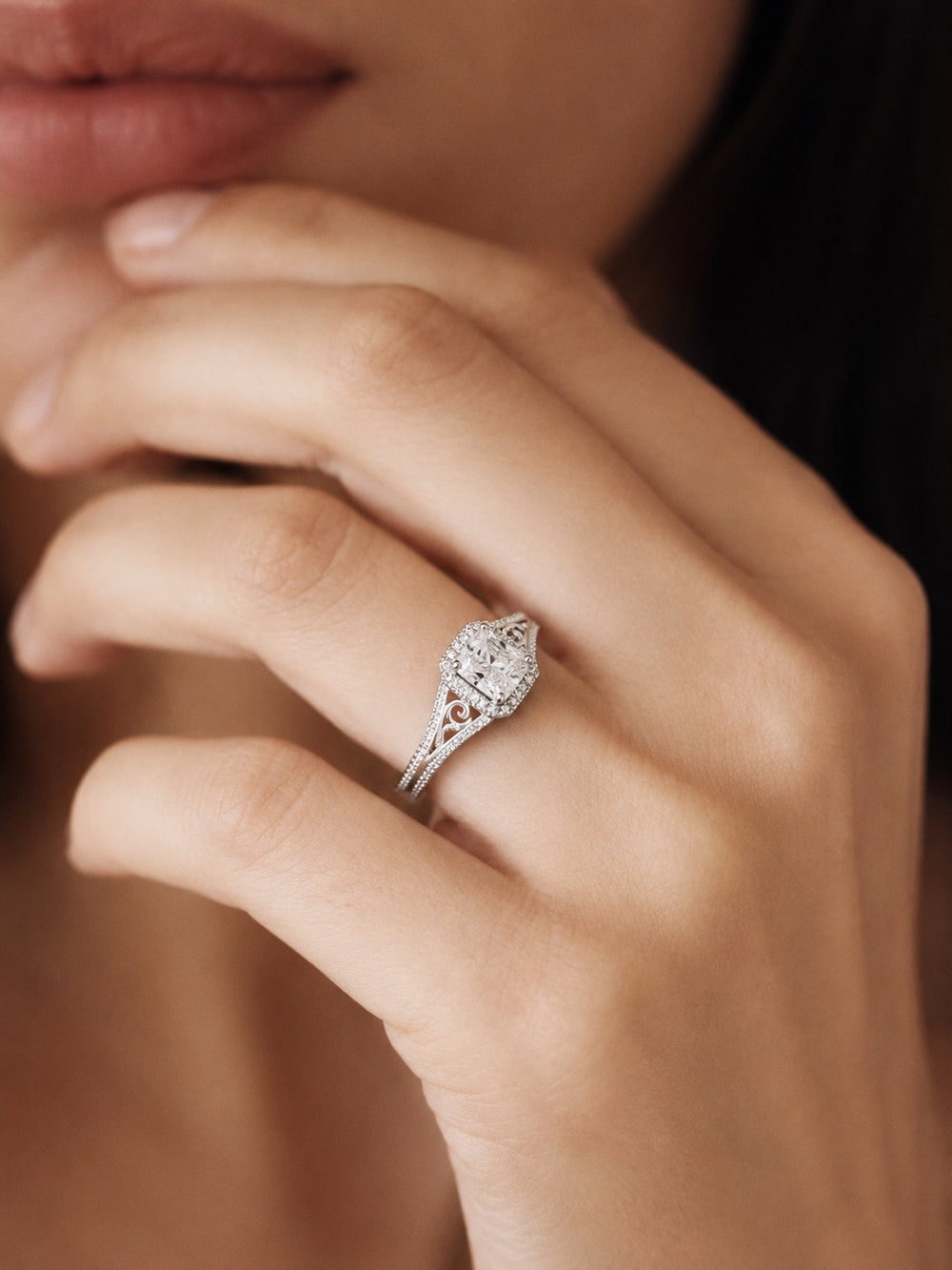 Oval solitaire ring in a white metal
