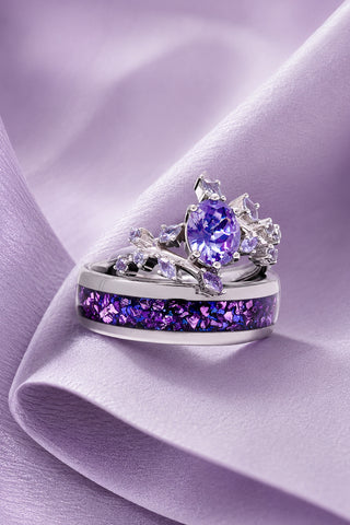 Sterling silver purple gemstone crown engagement ring stacked on a band with crushed purple stone inlay on lilac satin, Aquamarise bridal set collection banner