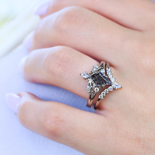 Close-up of the kite cut Herkimer diamond ring with its curved accent band on the finger