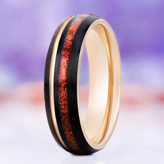 Solar Flare orange sandstone wedding band in rose gold and black tungsten, 6mm, standing view showing the off-set sparkling orange inlay and rose gold edges