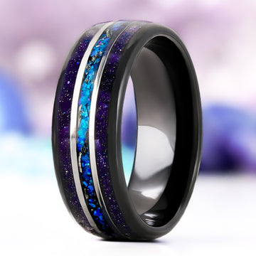 Starry Night Meteorite & Blue Opal men's wedding band in domed black tungsten, 8mm, standing upright with galaxy sandstone edges and a silver-lined blue opal and meteorite center channel