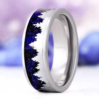 Starry Night & Trees men's wedding band in polished tungsten, 8mm, standing upright with silver pine-tree silhouettes over a sparkling midnight-blue sandstone inlay