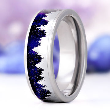 Starry Night & Trees men's wedding band in polished tungsten, 8mm, standing upright with silver pine-tree silhouettes over a sparkling midnight-blue sandstone inlay