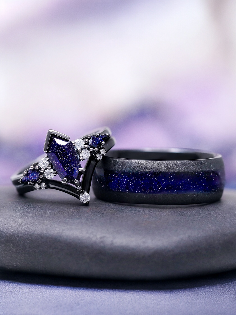Two rings with purple gemstones on a gray surface with a blurred purple background