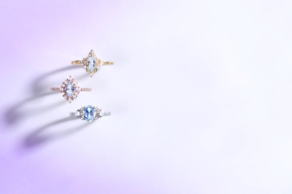 three aquamarine engagement rings march birthstone banner