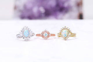 three opal rings October birthstone banner