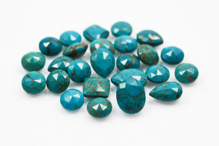 Turquoise gemstones on a white background