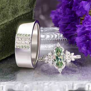 Viridian green tourmaline couples ring set in sterling silver, the 8mm leaf band standing beside the marquise engagement ring with purple flowers