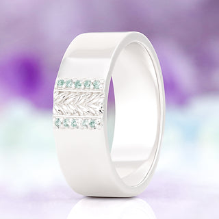 Viridian leaf men's wedding band in sterling silver, 8mm, standing view showing the engraved leaf pattern between two rows of green tourmaline