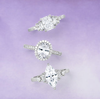 Three diamond rings on a purple gradient background