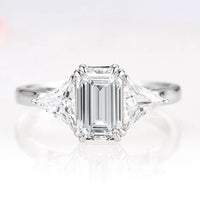 Emerald Cut Lab-Grown Diamond Engagement Ring- 14K White Gold (IGI Certified) by Aquamarise Gold, featuring a three-stone design with trillion side diamonds for timeless elegance.