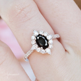Astra Black Onyx Engagement Ring in Sterling Silver by Aquamarise featuring an oval black onyx center with a sparkling diamond halo on a polished sterling silver band.