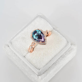 Art Deco Alexandrite Ring in 14K Rose Gold Vermeil by Aquamarise featuring a pear-shaped color-changing alexandrite surrounded by delicate diamonds on a vintage-inspired rose gold band